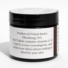 Primal Basics ingredient label closeup emphasizing grass-fed tallow and vanilla oil