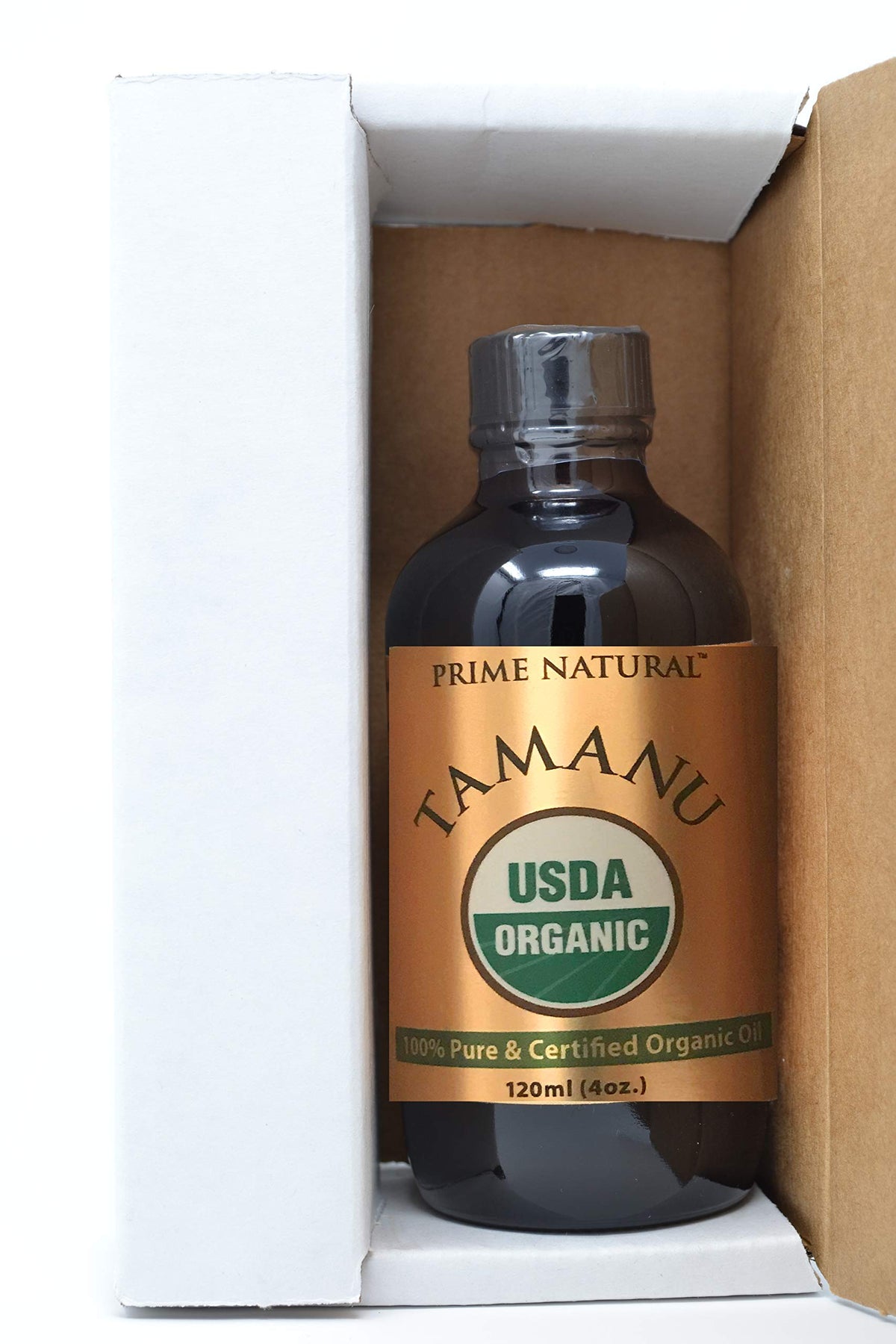PRIME NATURAL bottle held in hand to show 4oz size and scale