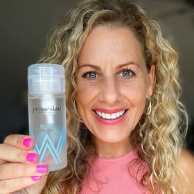 PRIME PROMETICS bottle on nightstand illustrating calming bedtime skincare ritual