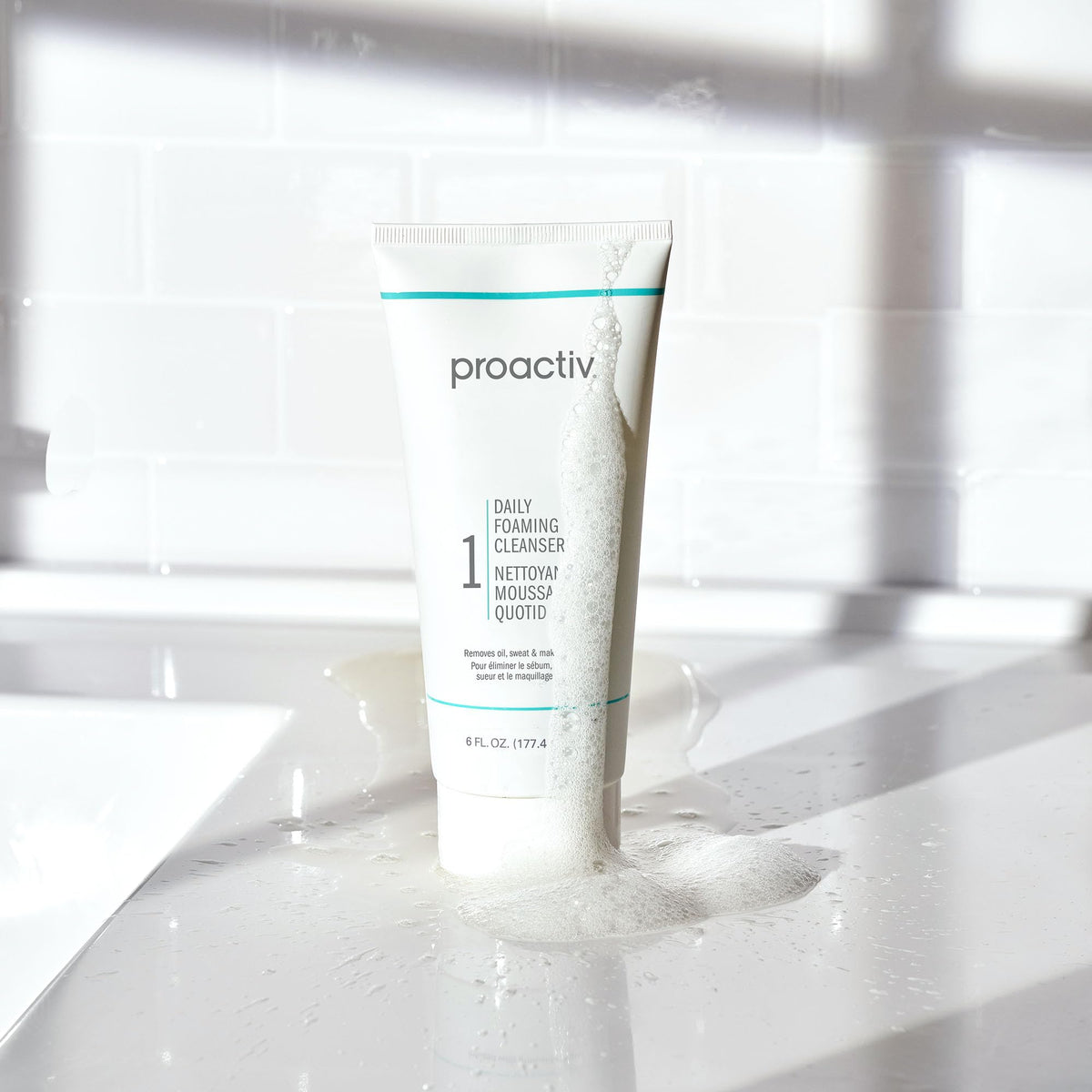 Proactiv ingredient callout with niacinamide and kakadu plum promoting brighter tone.