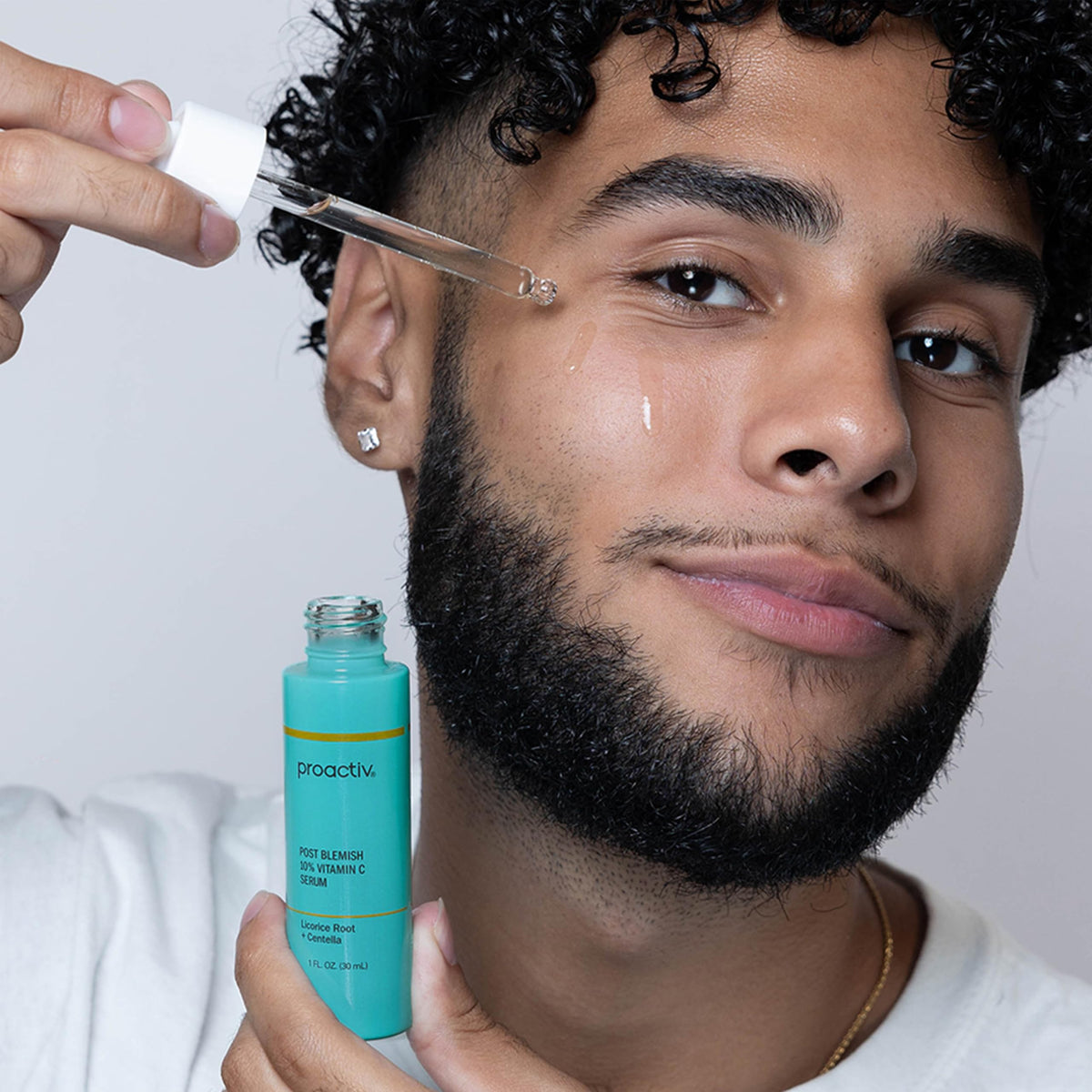 Proactiv serum held in hand to illustrate bottle size and scale