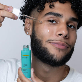 Proactiv serum held in hand to illustrate bottle size and scale