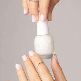 Probelle applying polish on hand demonstrating quick natural look benefit