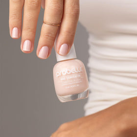 Probelle being applied to yellowed nail to mask discoloration