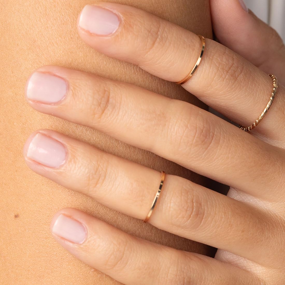 Bottle next to moisturized cuticles illustrating Probelle nourishing benefit