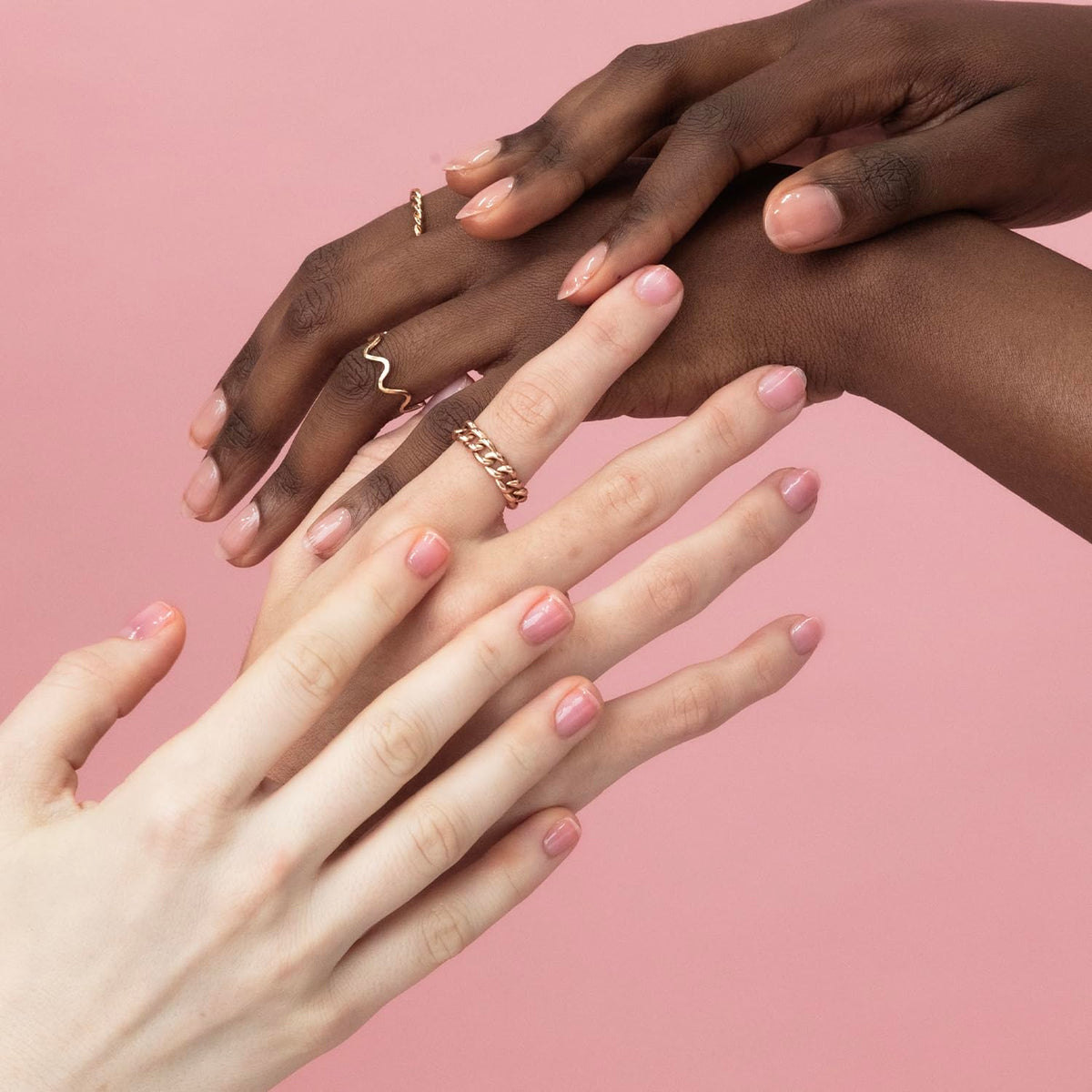 Probelle on hands at desk showing wearable everyday shine benefit
