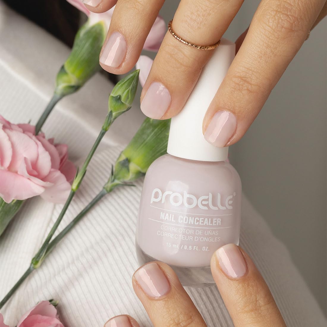 Probelle polish swatch on fingertips demonstrating concealed discoloration