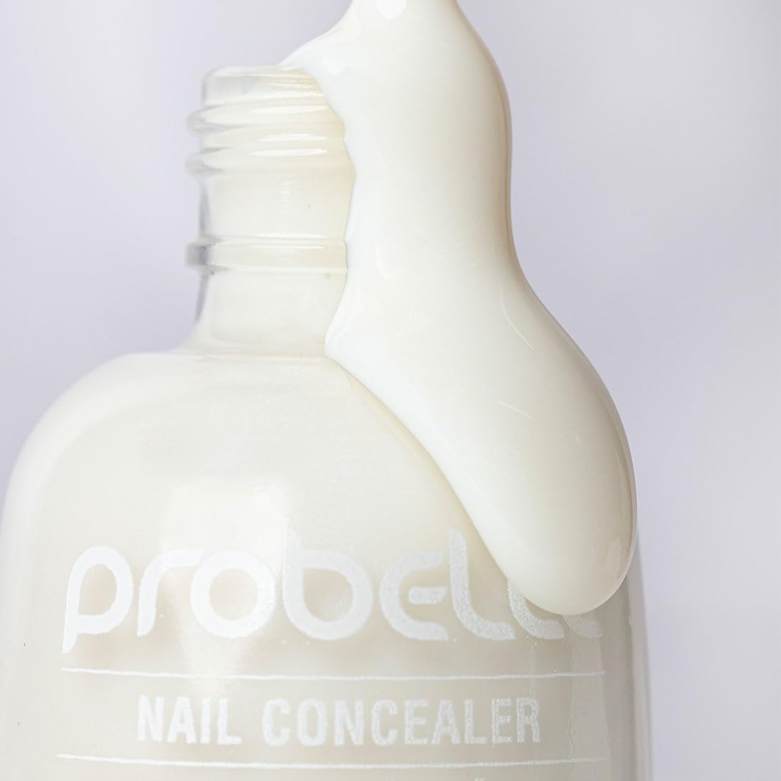 Probelle bottle next to coin showing compact size and scale benefit