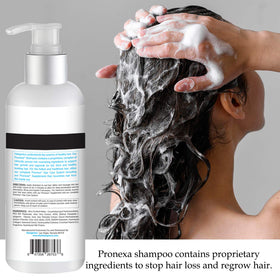 Person applying Pronexa shampoo in shower showing scalp massage benefit