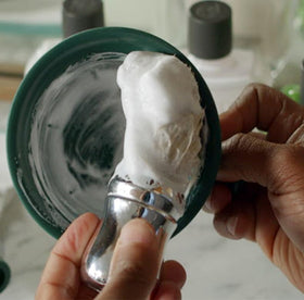Proraso shaving cream lather closeup highlighting rich cushion for smooth razor glide