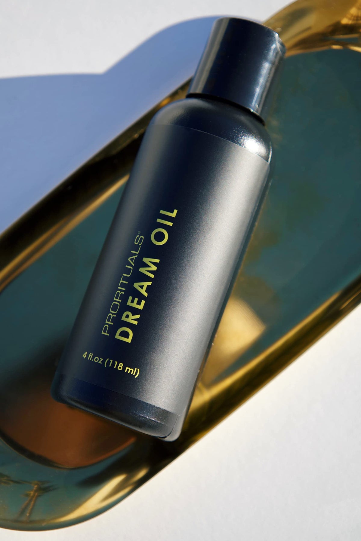 Prorituals Dream Cream being applied to damp hair demonstrating detangling and smoother styling
