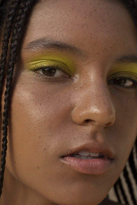 Pseudo Labs lifestyle outdoor model wearing freckles showing long-wear water resistance