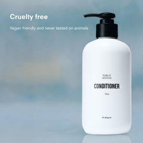 Public Goods conditioner texture in hand showing creamy hydration