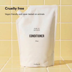 Public Goods conditioner texture close-up demonstrating creamy moisturizing benefit