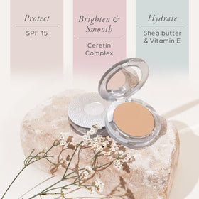 PÜR MINERALS open compact with applicator puff for quick touch-ups on the go