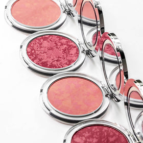 PÜR MINERALS brush applying Pretty in Peach to cheek showing natural buildable color benefit