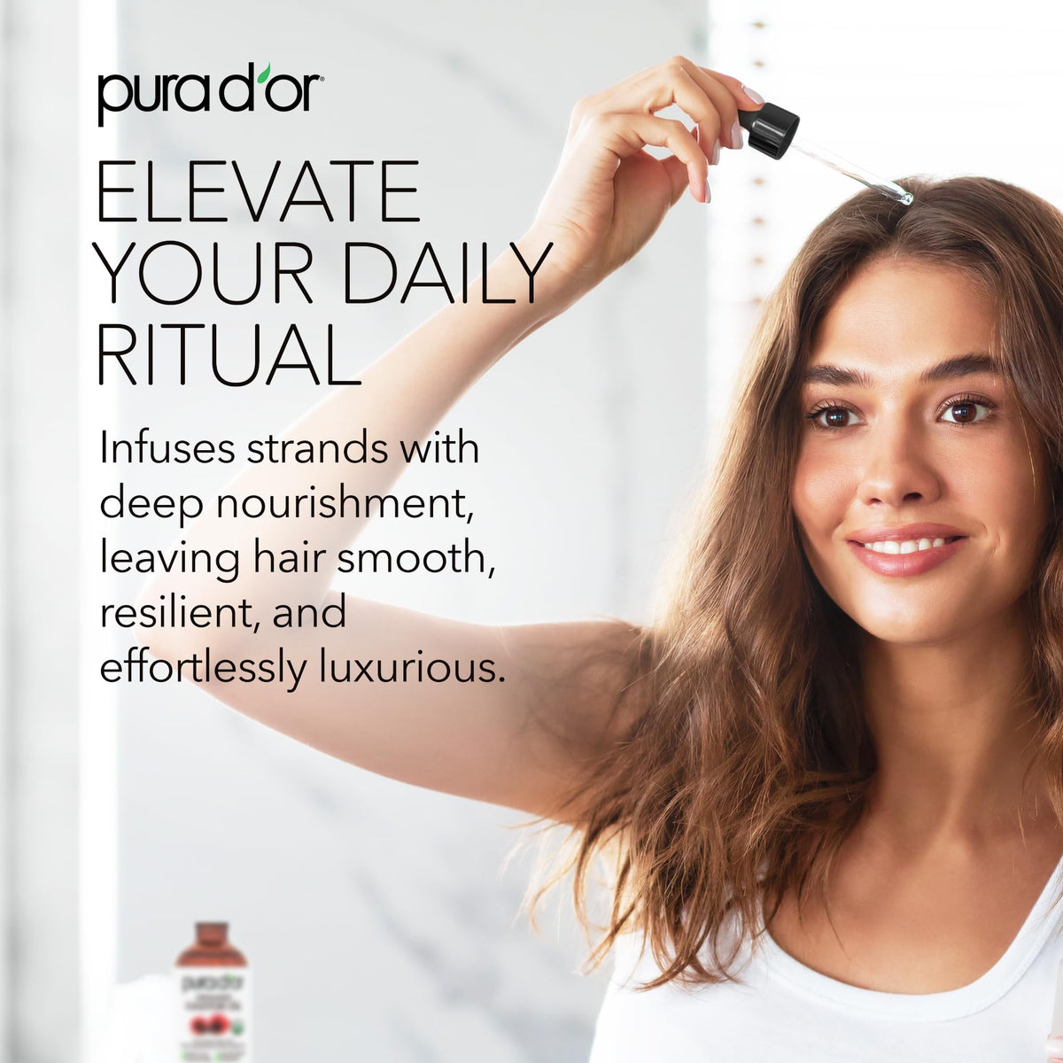 PURA D'OR hair treatment in hands showing easy absorption and shine