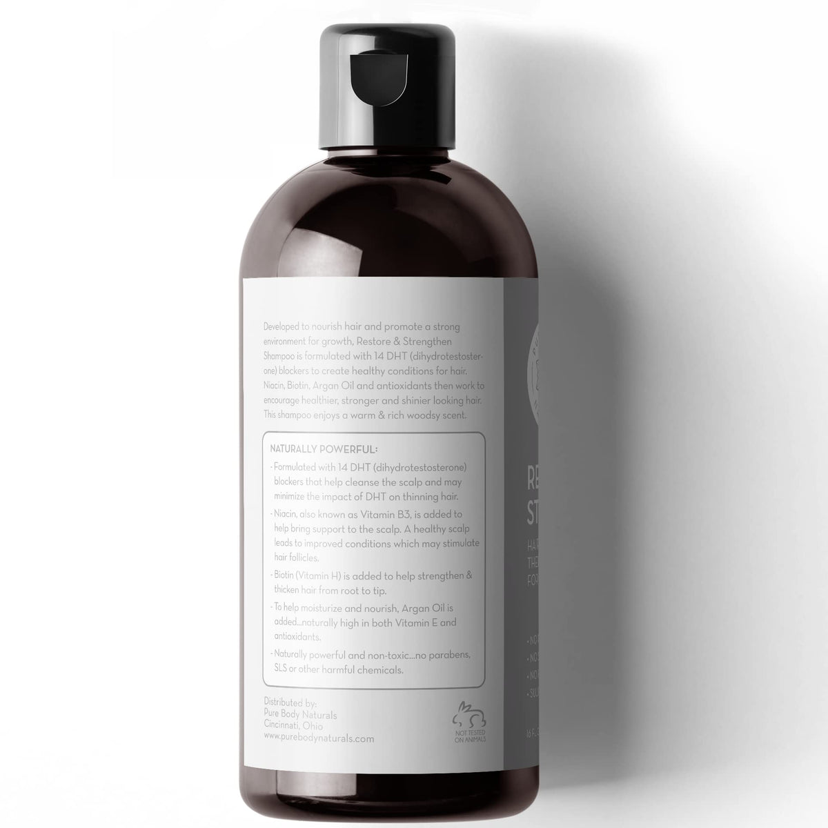 Person using Pure Body Naturals in shower illustrating nourishing scalp massage