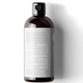 Person using Pure Body Naturals in shower illustrating nourishing scalp massage