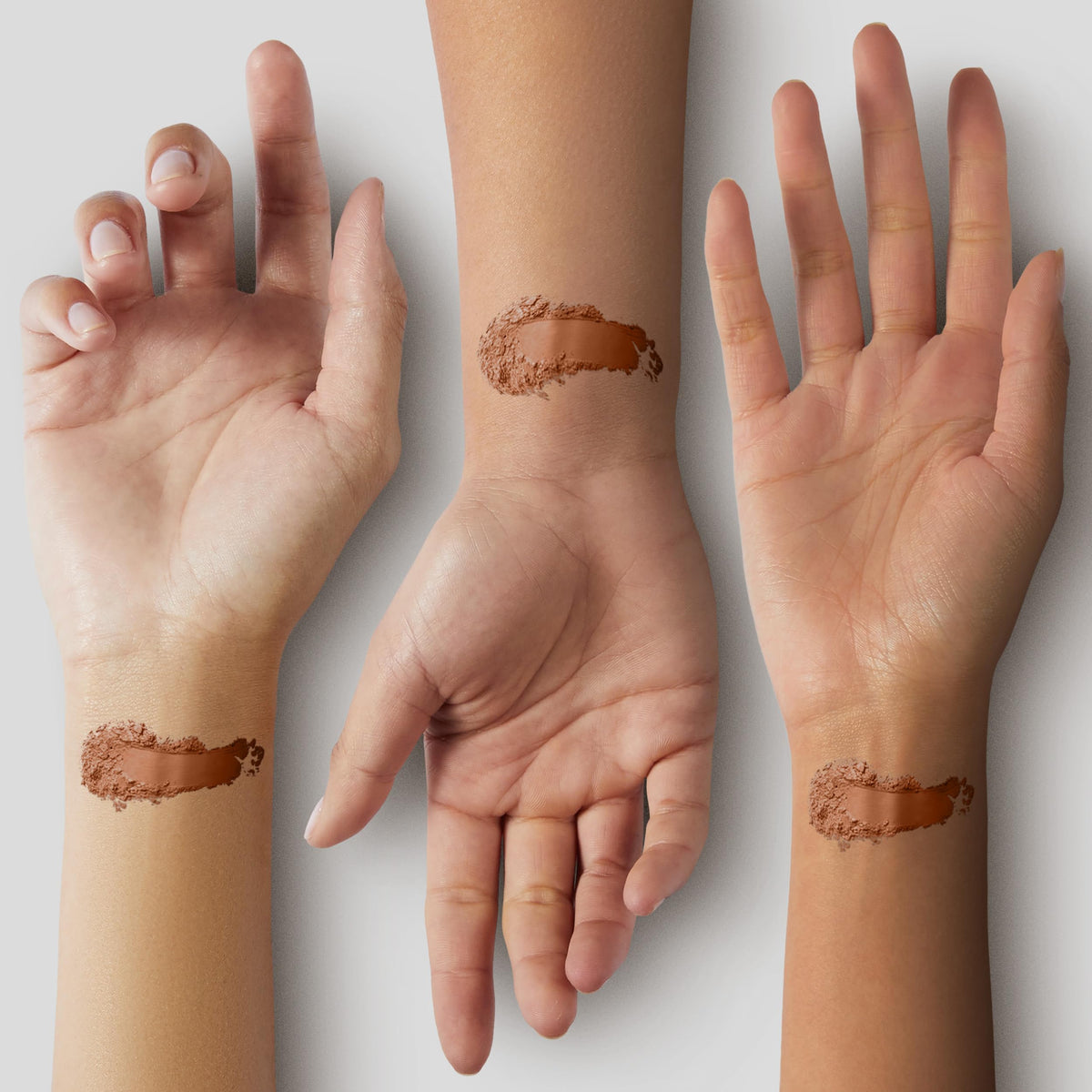 Pure Minerals applied on model cheek demonstrating warm sun-kissed glow