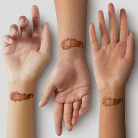 Pure Minerals applied on model cheek demonstrating warm sun-kissed glow