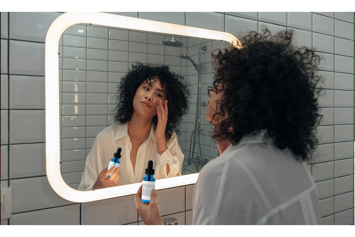Pure Original Ingredients on bathroom counter next to skincare items suggesting routine integration benefit