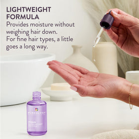 Pureology bottle in hand for scale demonstrating travel-friendly size advantage