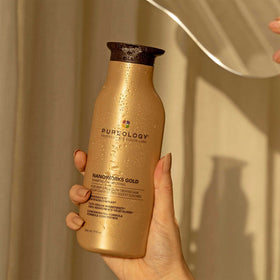 Pureology bottle held in hand for scale showing true 9 fl oz size