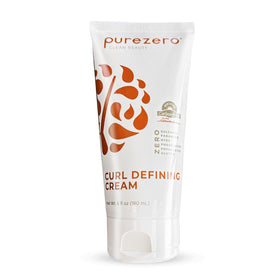 Purezero being applied to damp curls demonstrating frizz control and curl definition