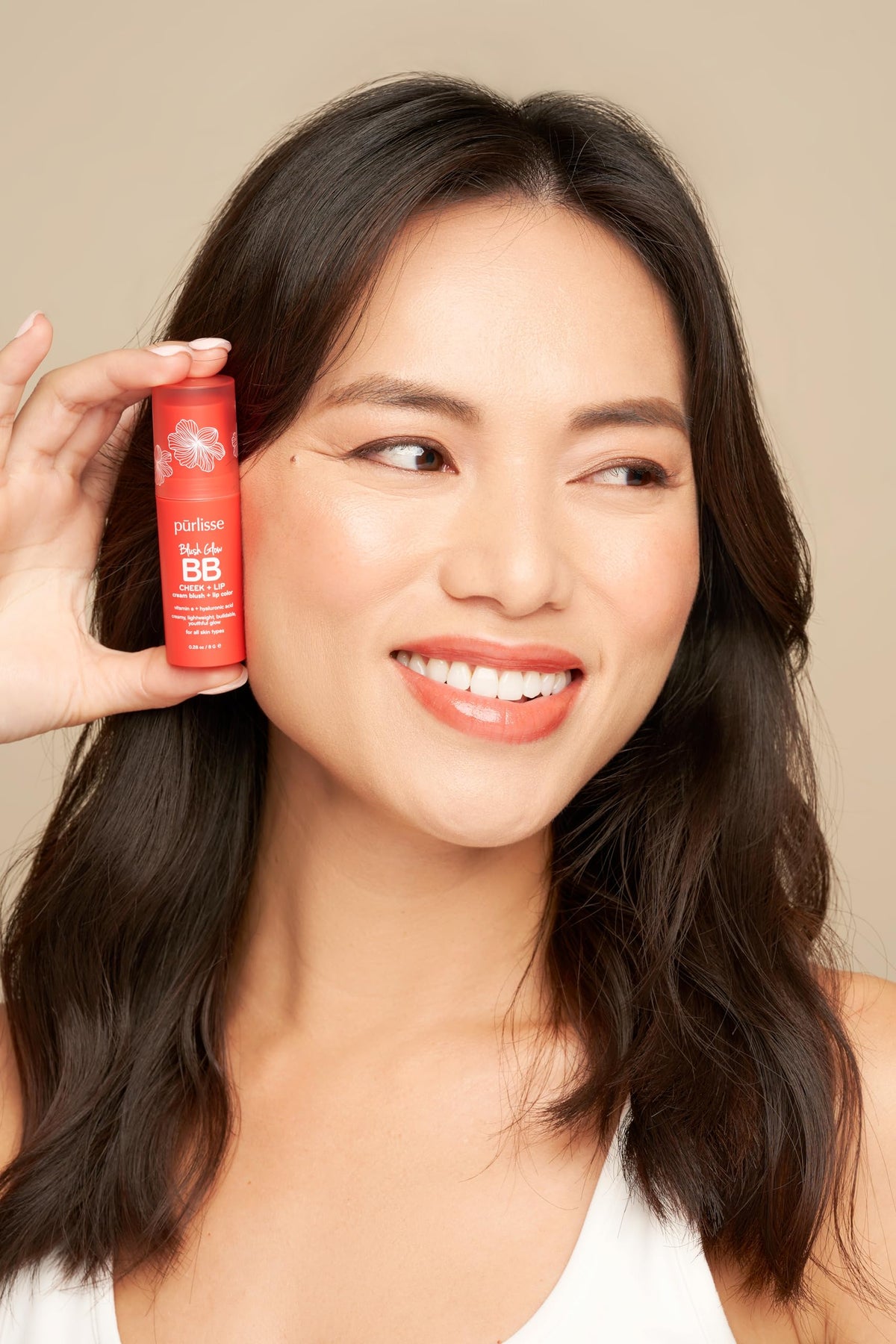 pūrlisse capped lip and cheek stick highlighting portable packaging benefit