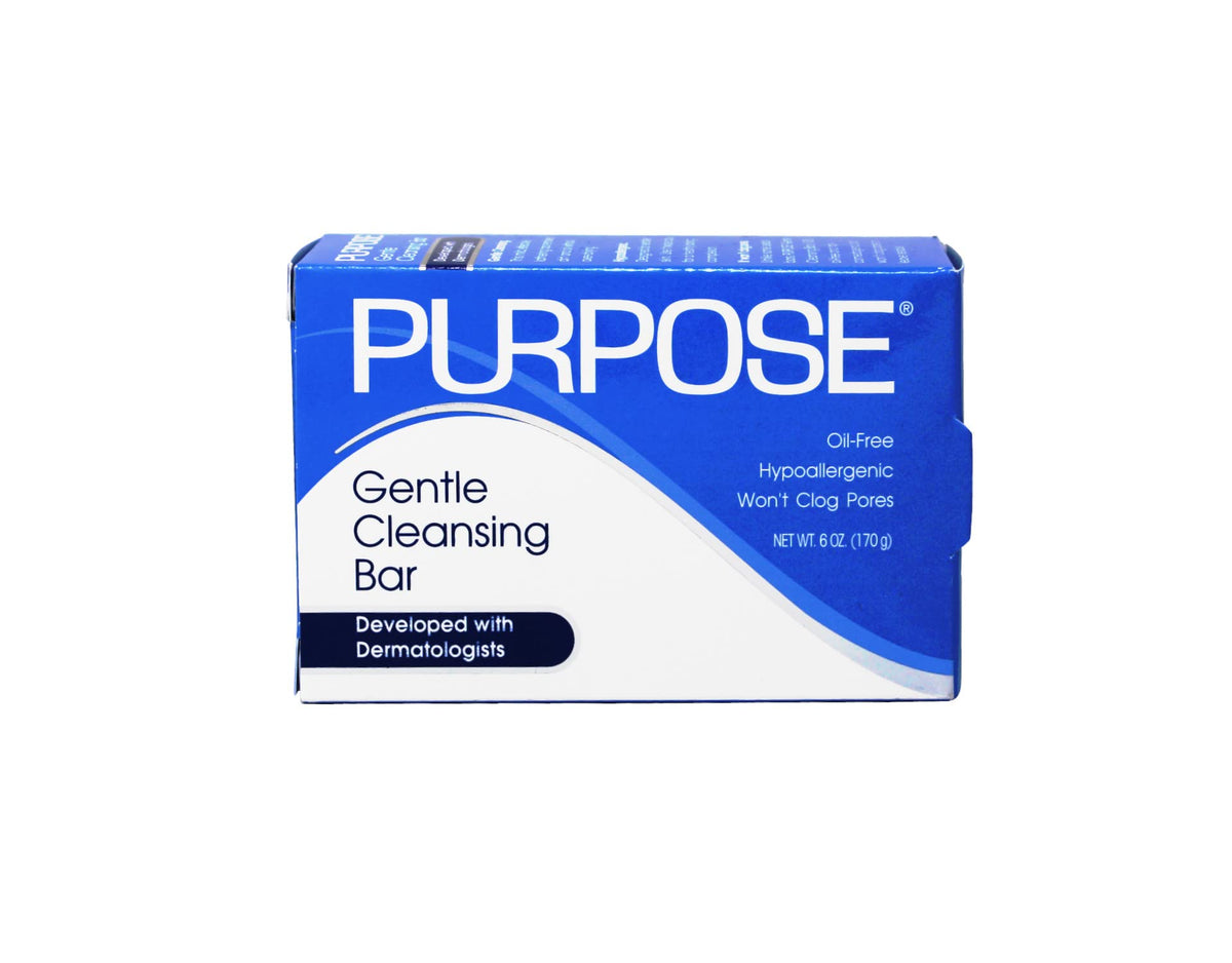 PURPOSE cleansing bar held in hand to show size and easy handling benefit
