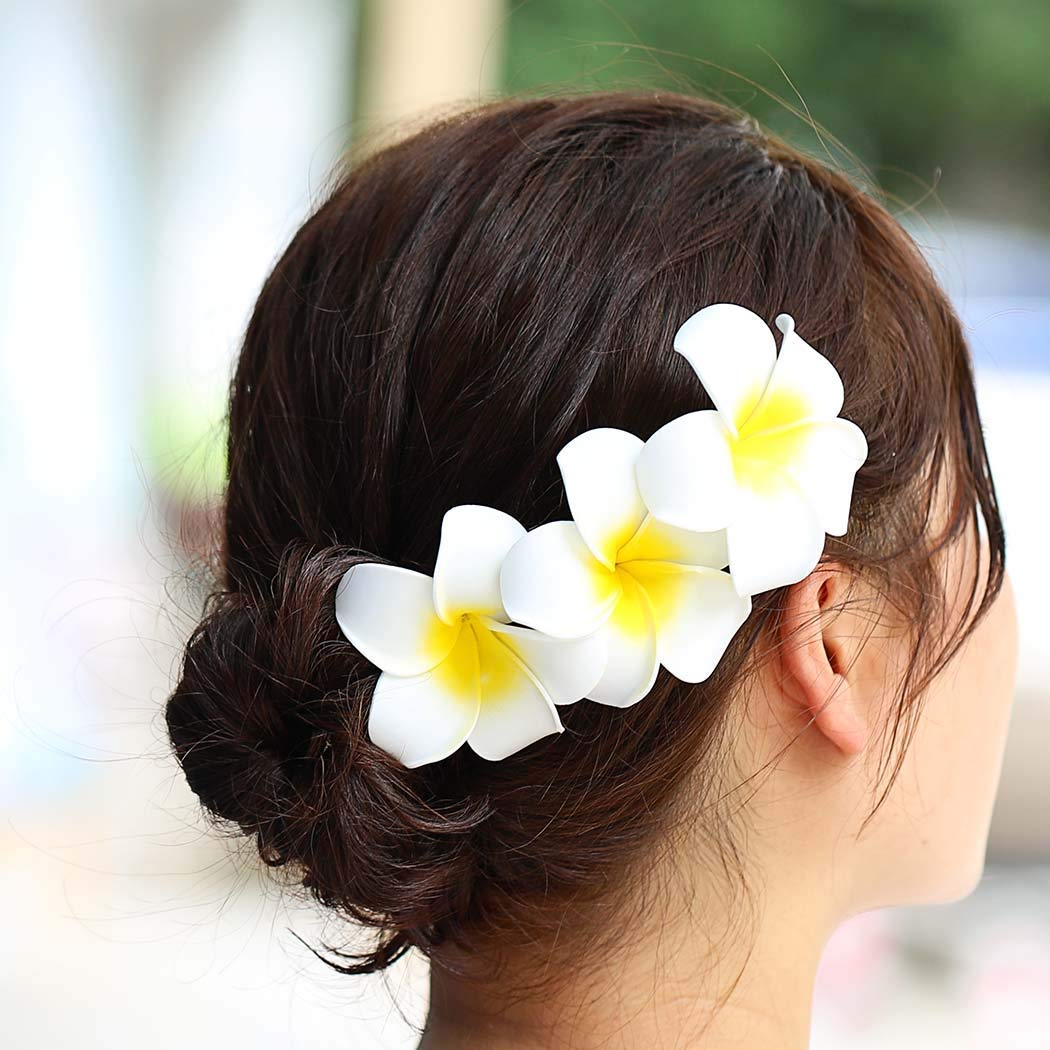 Pursuestar hair styling example with clip in place adding tropical accent and secure fit