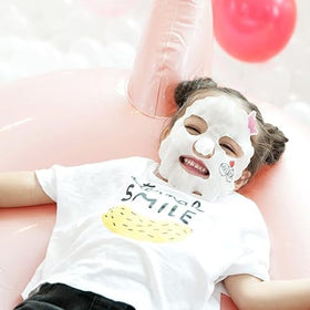 Puttisu mask beside ruler showing exact kids-size fit