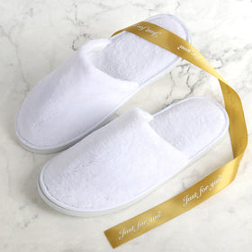 QatmMkt lifestyle image of guest wearing slippers for welcoming comfort