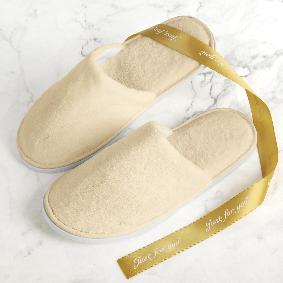 QatmMkt slippers on bedroom floor illustrating guest-ready comfort