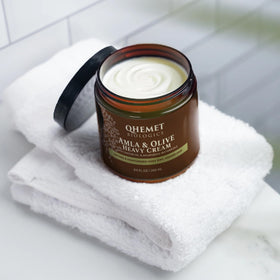 Qhemet Biologics open jar texture close-up demonstrating creamy, thick moisture