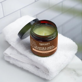 Qhemet Biologics pomade texture in jar emphasizing creamy moisturizing feel