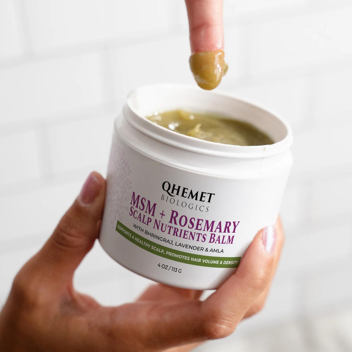 Qhemet Biologics balm texture close-up highlighting creamy nutrient-rich consistency
