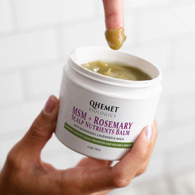 Qhemet Biologics balm texture close-up highlighting creamy nutrient-rich consistency