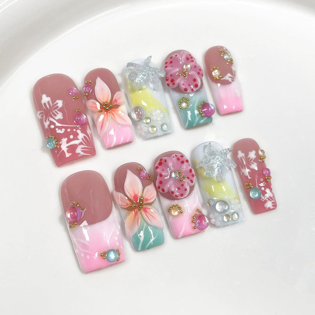 Qicaijia front view of full 10-piece press-on nail set showing packaging and included glue for quick application