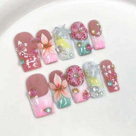 Qicaijia front view of full 10-piece press-on nail set showing packaging and included glue for quick application