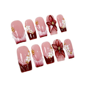 Qicaijia rhinestone and red French tip emphasizing sparkle and polished finish