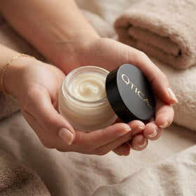 QTICA jar in a small travel pouch, convenient on-the-go cuticle care