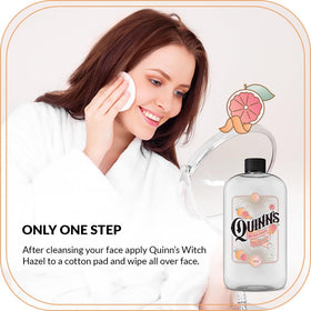 Quinn's bottle beside pink grapefruit and orange for natural citrus fragrance cue
