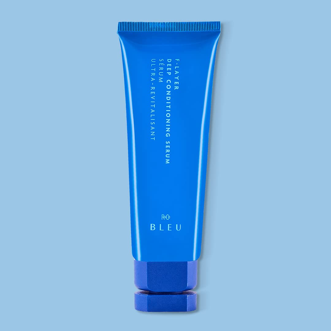 R+Co BLEU serum texture drop on fingertip showing lightweight absorbent feel for smooth finish