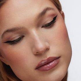 r.e.m. beauty swatches on skin showing rich midnight black pigment payoff