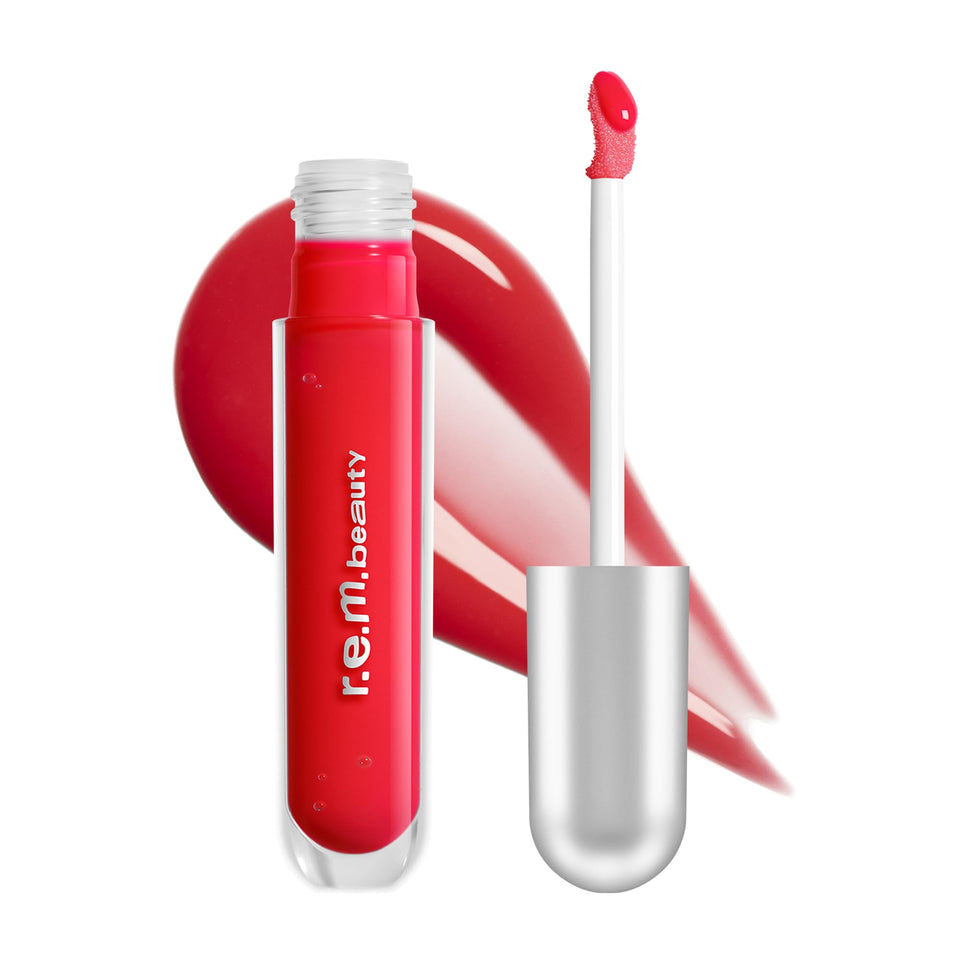 r.e.m. beauty front tube showing Shirley shade and glossy finish benefit