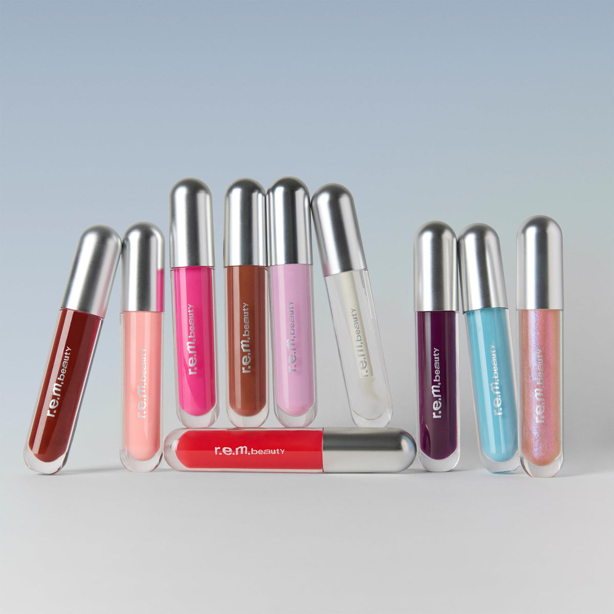 r.e.m. beauty size comparison next to coin showing portable, travel-friendly benefit