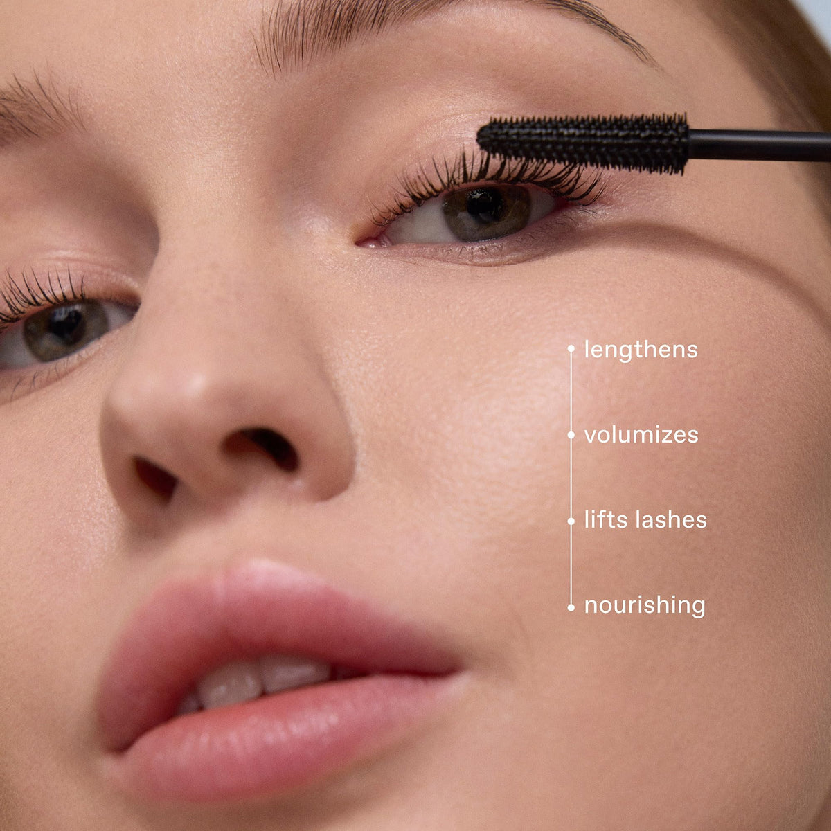 r.e.m. beauty mascara beside a coin to show compact travel-friendly size