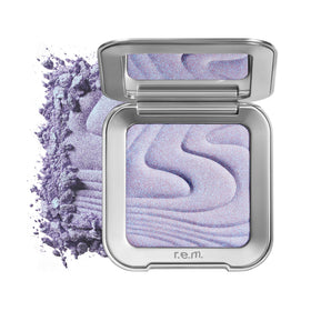 r.e.m. beauty front packaging showing sleek compact and brand logo, highlights premium design
